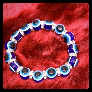 Blue eye bracelet with clear stones in the middle